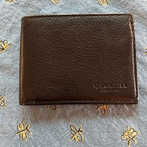 Coach Black Leather Wallet.  4 credit card slots, one plastic ID slot.